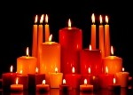 Large group of mixed candles burning